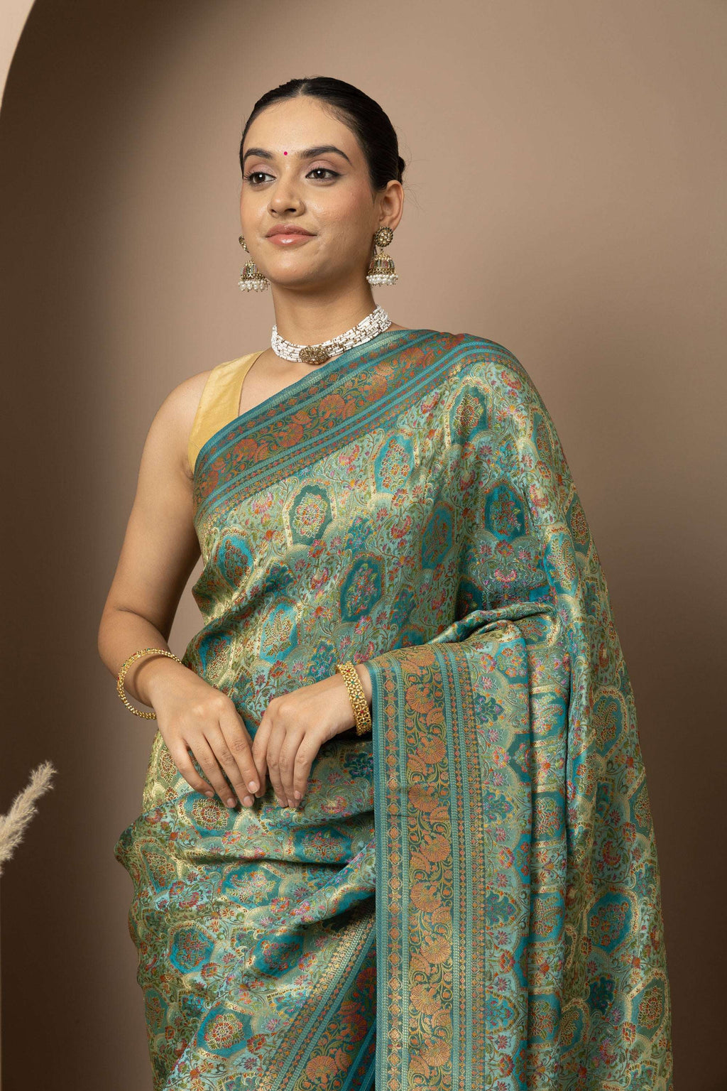Teal Green Saree with Opulent Gold Zari Weaving