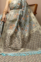 Powder Blue Linen Saree with Multicolour Floral Accents