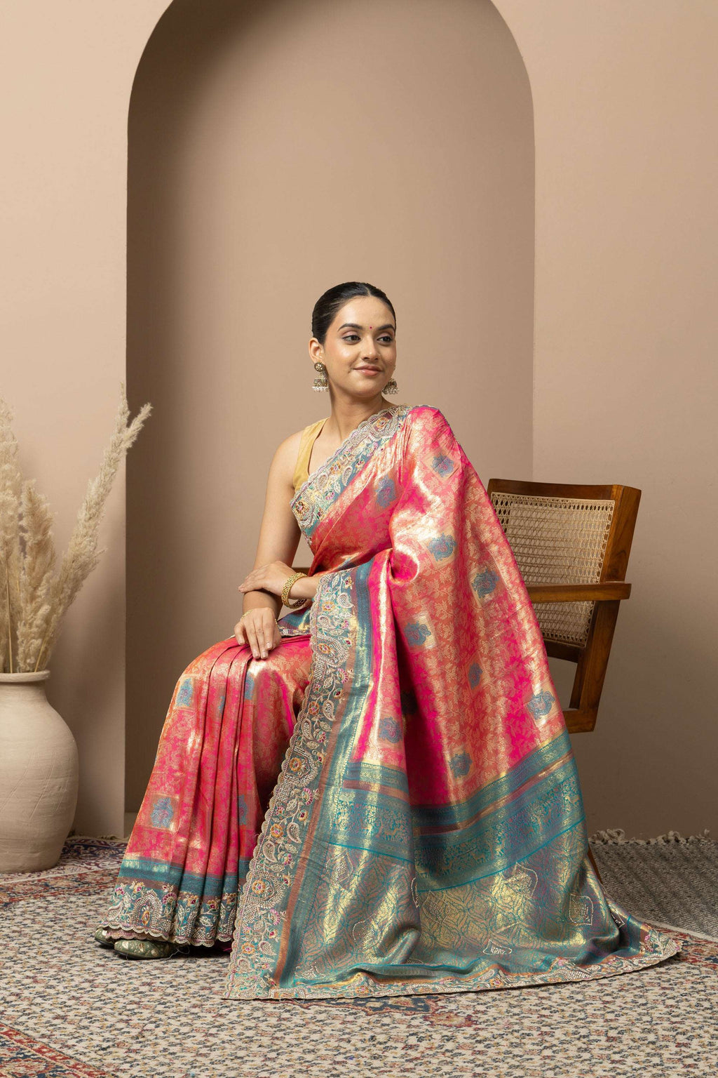 Rani Pink Saree with Teal & Gold Statement Accents
