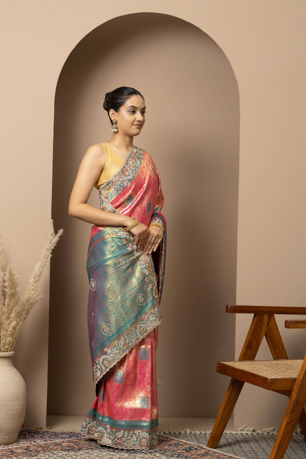 Rani Pink Saree with Teal & Gold Statement Accents