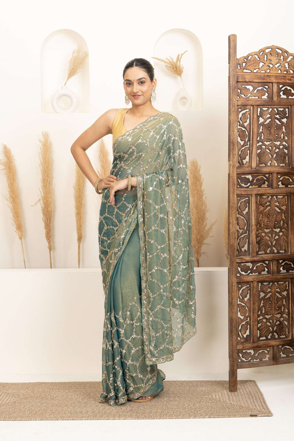 Sage Green Saree with Intricate Silver Embellishments