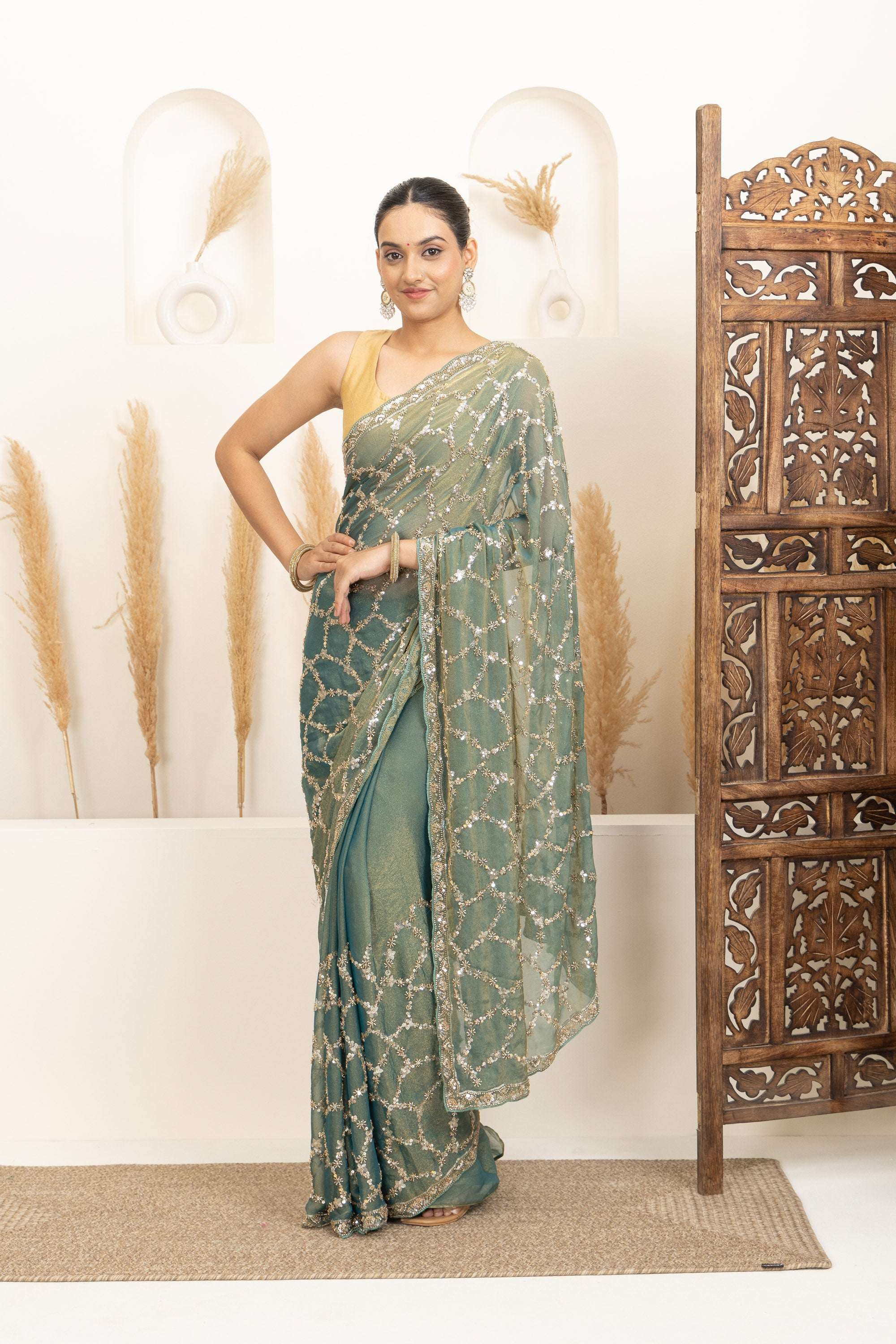 Sage Green Saree with Intricate Silver Embellishments