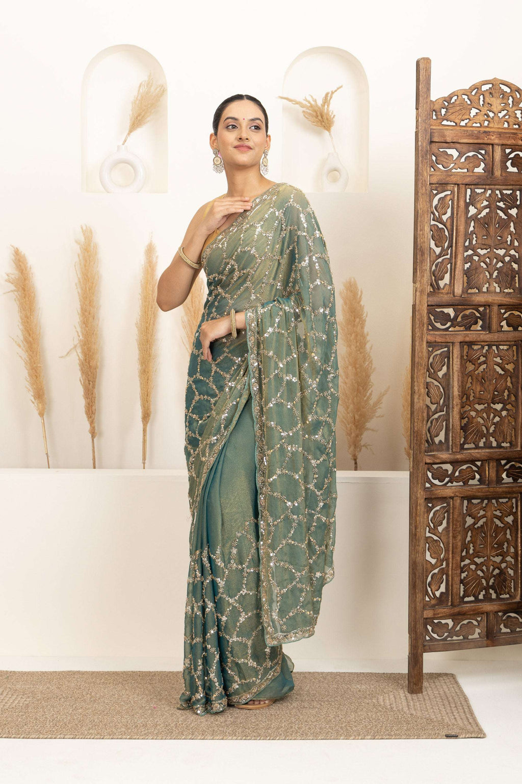Sage Green Saree with Intricate Silver Embellishments