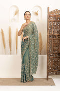 Sage Green Saree with Intricate Silver Embellishments