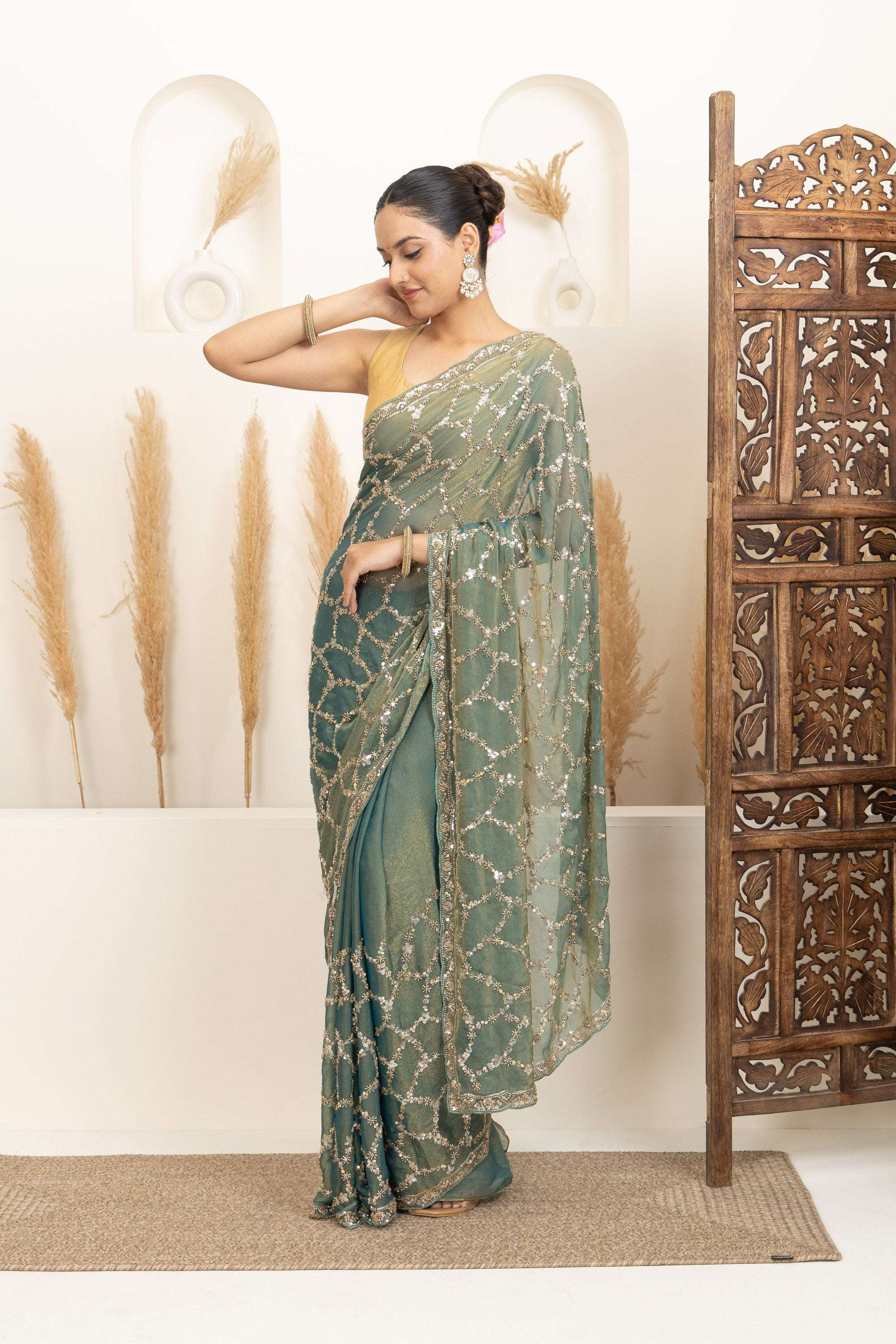Sage Green Saree with Intricate Silver Embellishments