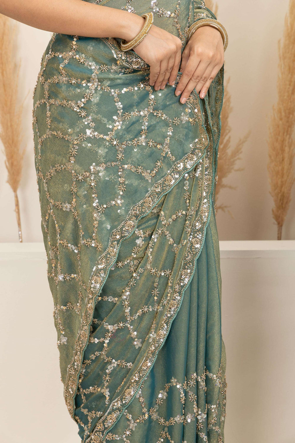 Sage Green Saree with Intricate Silver Embellishments