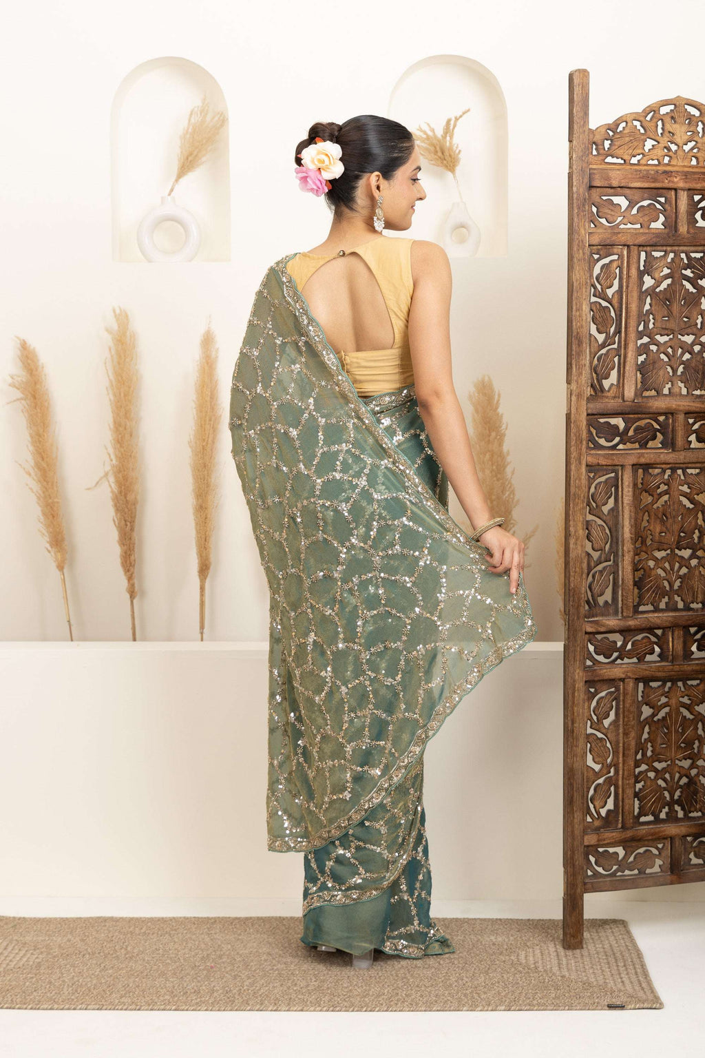 Sage Green Saree with Intricate Silver Embellishments