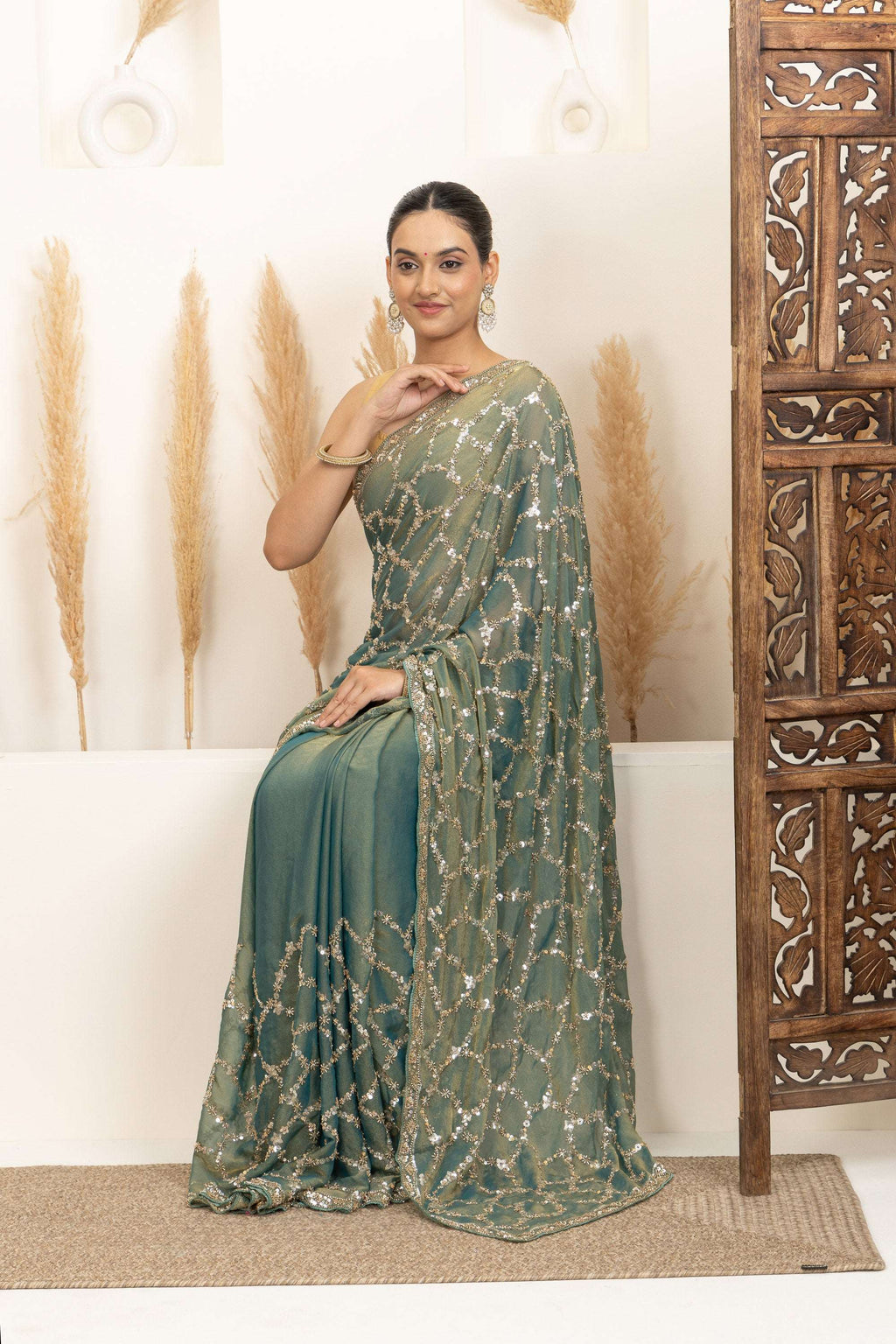 Sage Green Saree with Intricate Silver Embellishments