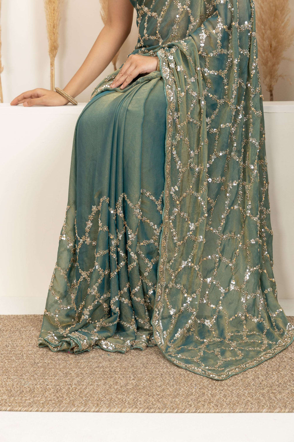 Sage Green Saree with Intricate Silver Embellishments