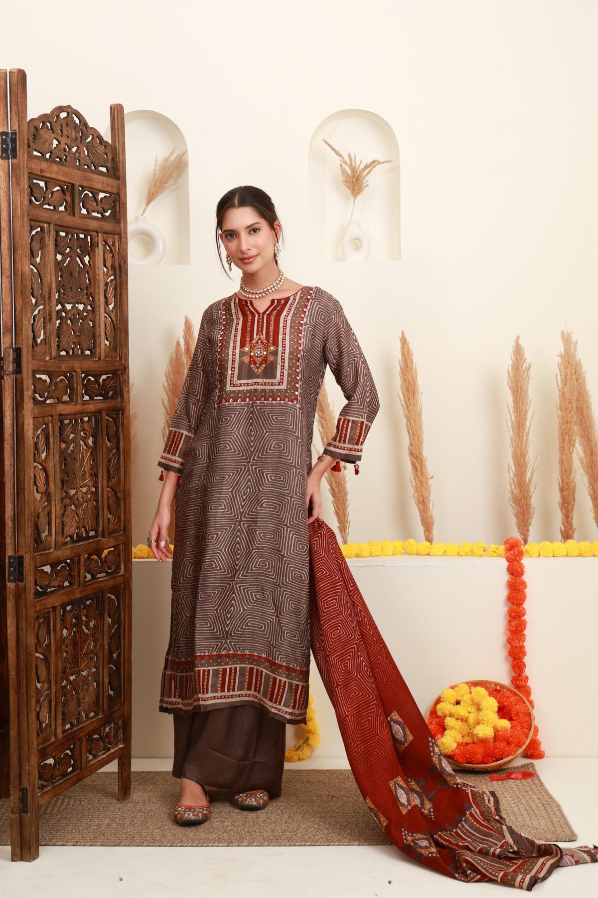 Brown geometric printed embroidered kurta set with wide-leg trousers and maroon dupatta