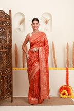 Coral orange traditional motif saree for women with gold border