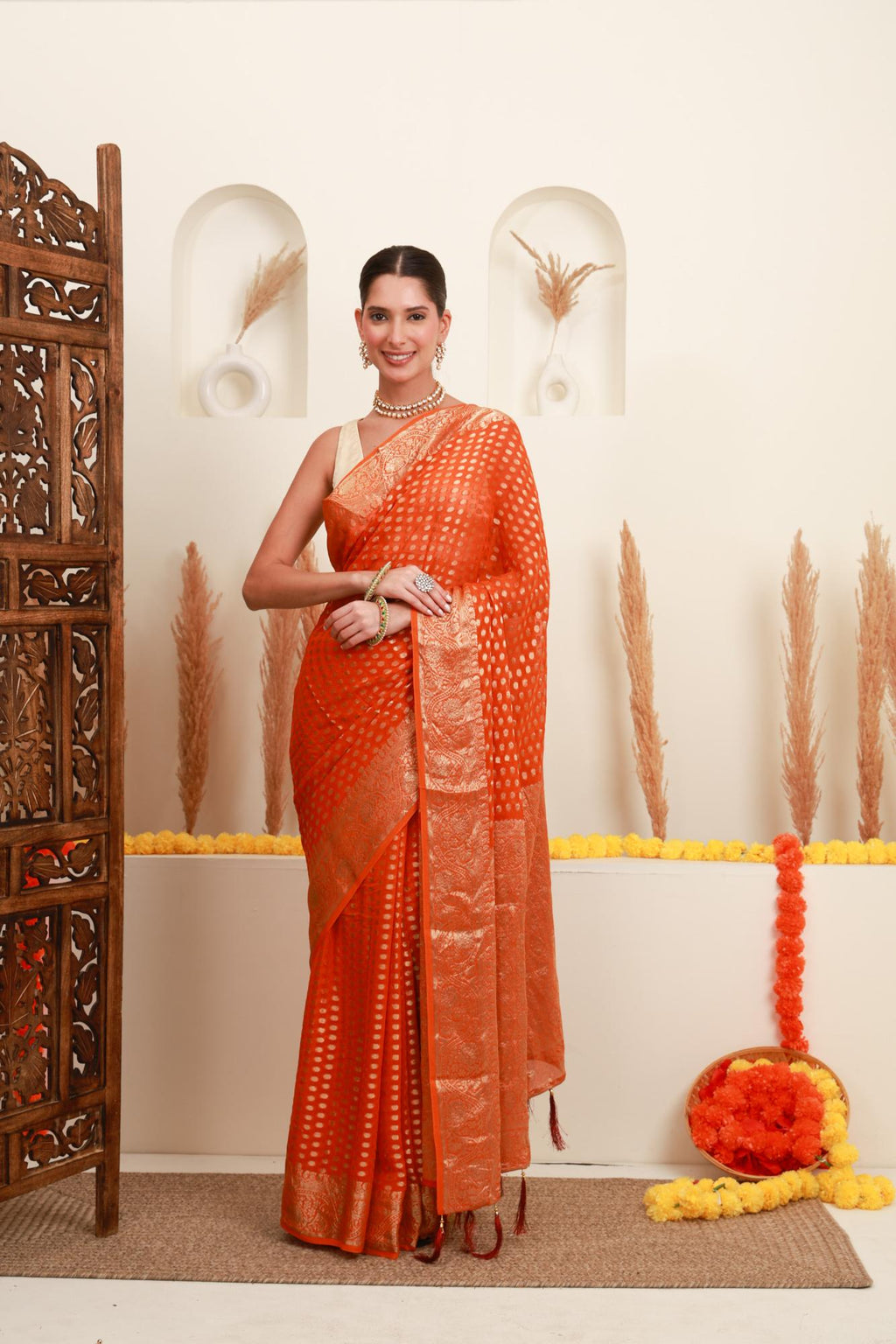 Orange gold polka saree for women with traditional gold border
