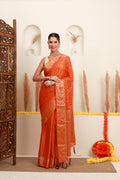 Orange gold polka saree for women with traditional gold border