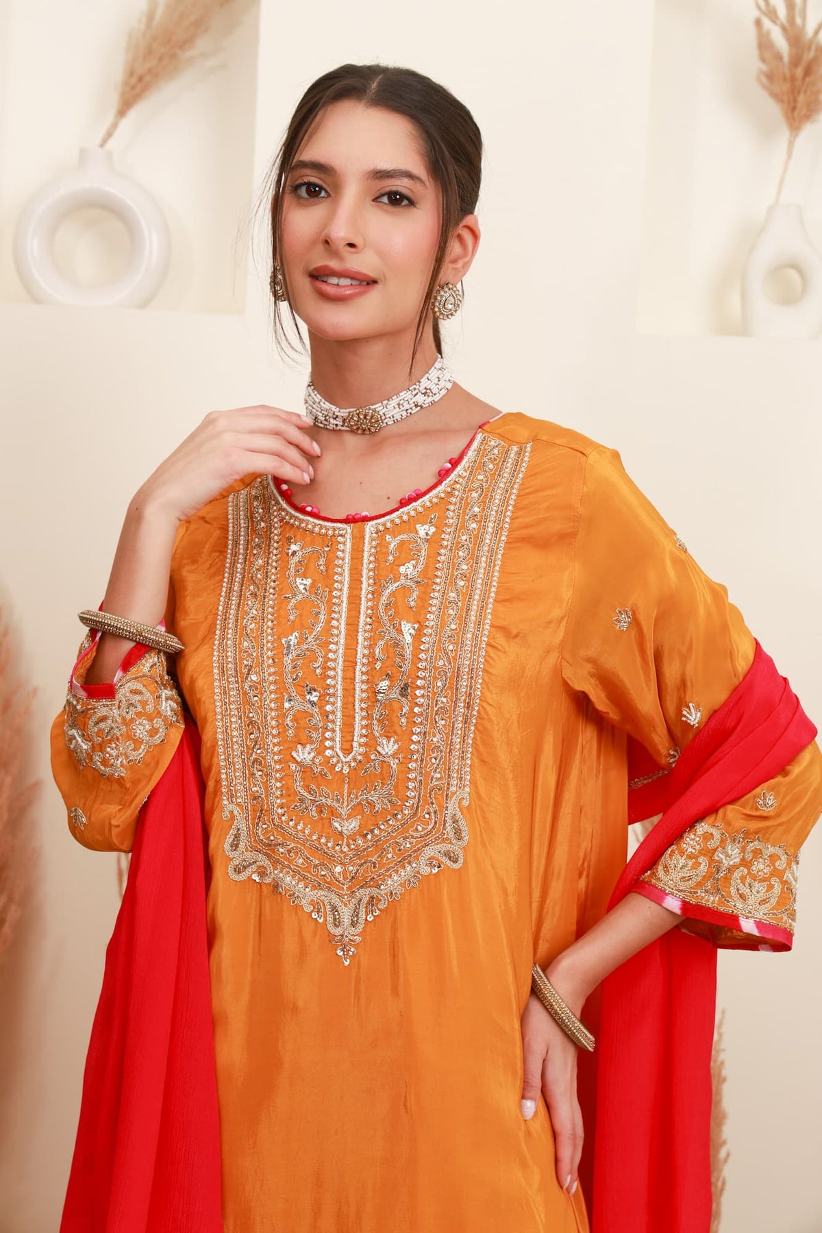 Orange and red embroidered kurta with Farshi Salwar and red dupatta