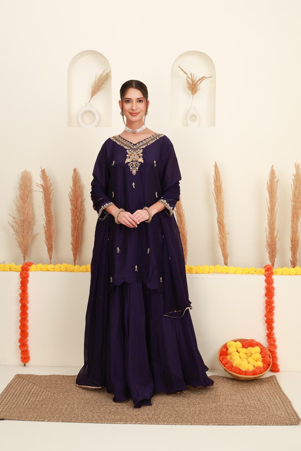 Purple embroidered flared skirt set for women with antique-gold detailing and sheer dupatta front