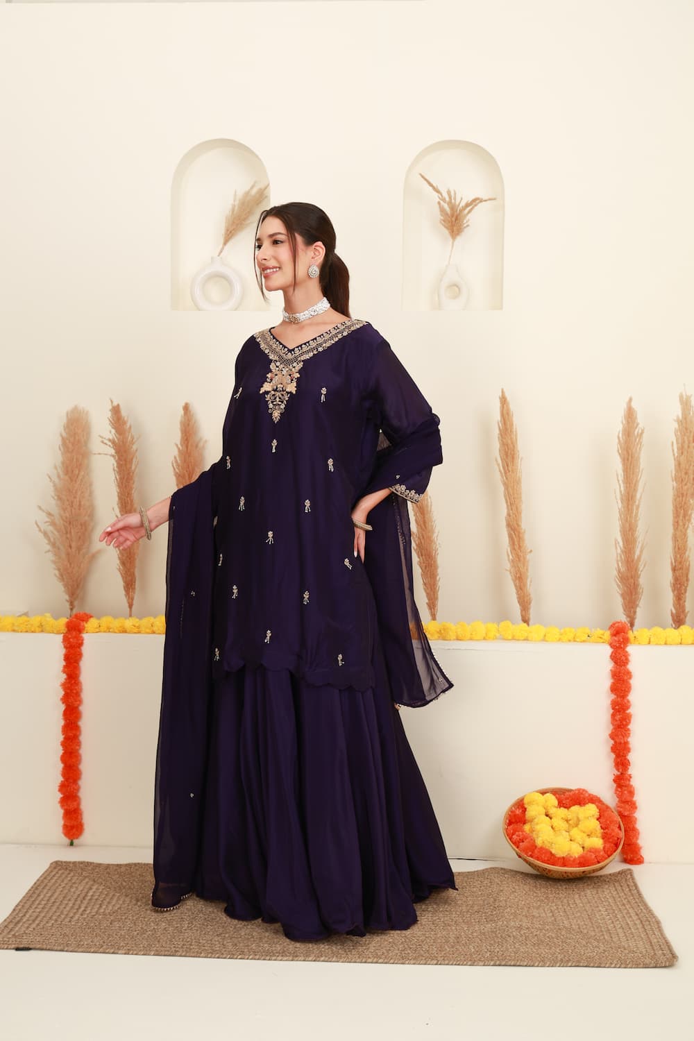 Purple embroidered flared skirt set for women with antique-gold detailing and sheer dupatta front 2