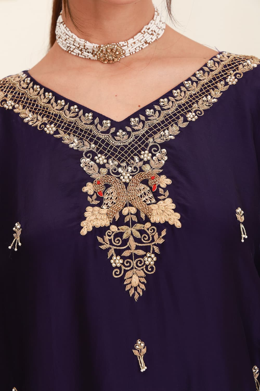 Purple embroidered flared skirt set for women with antique-gold detailing and sheer dupatta
