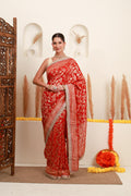 Red gold Banarasi-style saree for women with floral motifs